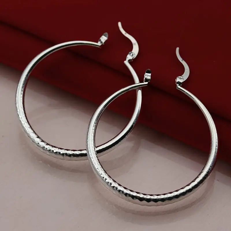 Gleaming Silver Plated Big Hoop Earrings - The Perfect Jewelry Accessory Charm for that quick put together look.